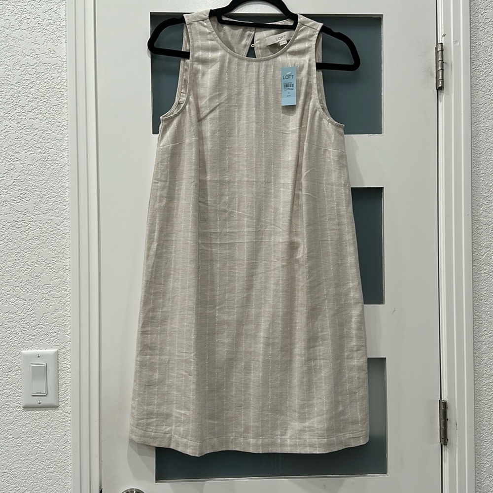 Sleeveless beige pin strip with silver thread petite dress.  New with tags